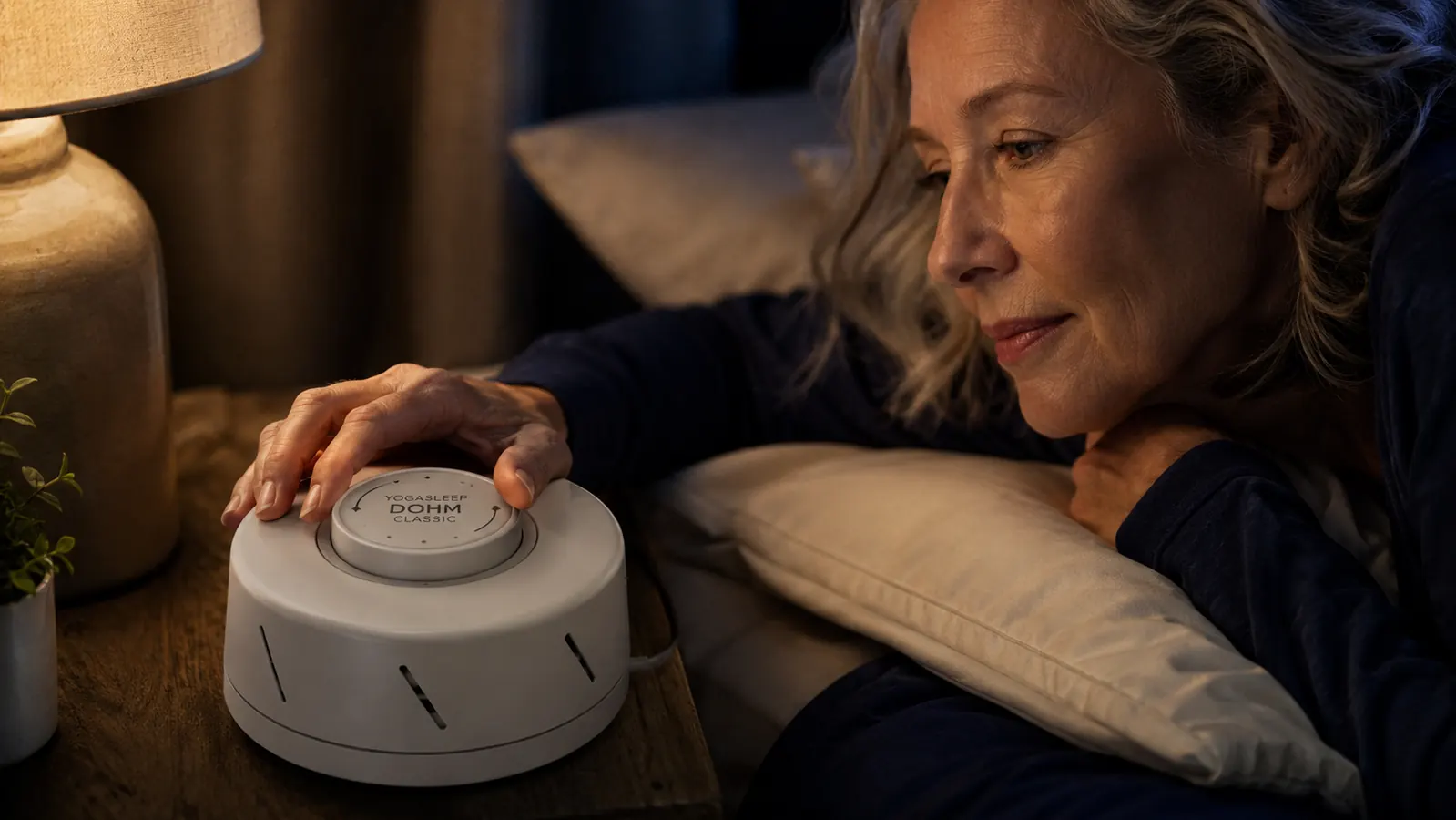 Close-up of the two adjustable plastic caps on top of the Dohm Classic showing the tuning controls in a well-used bedroom setting